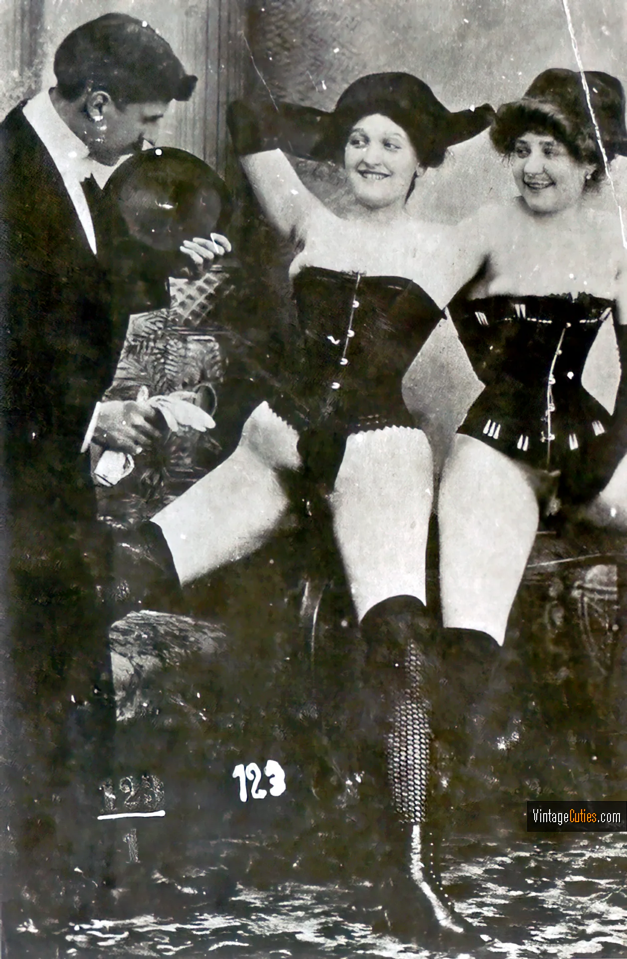 Two provocative antique babes show their hairy pussies to a gentleman