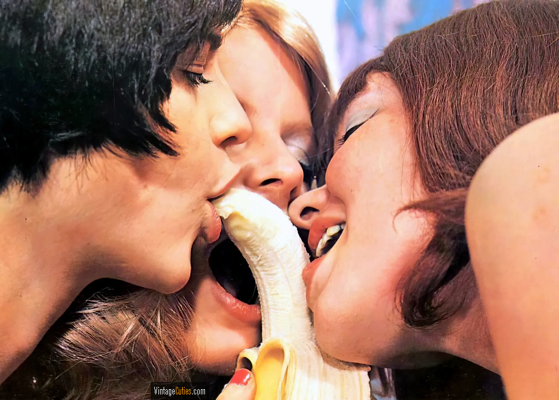 Three horny lesbian classic teens suck and lick a banana