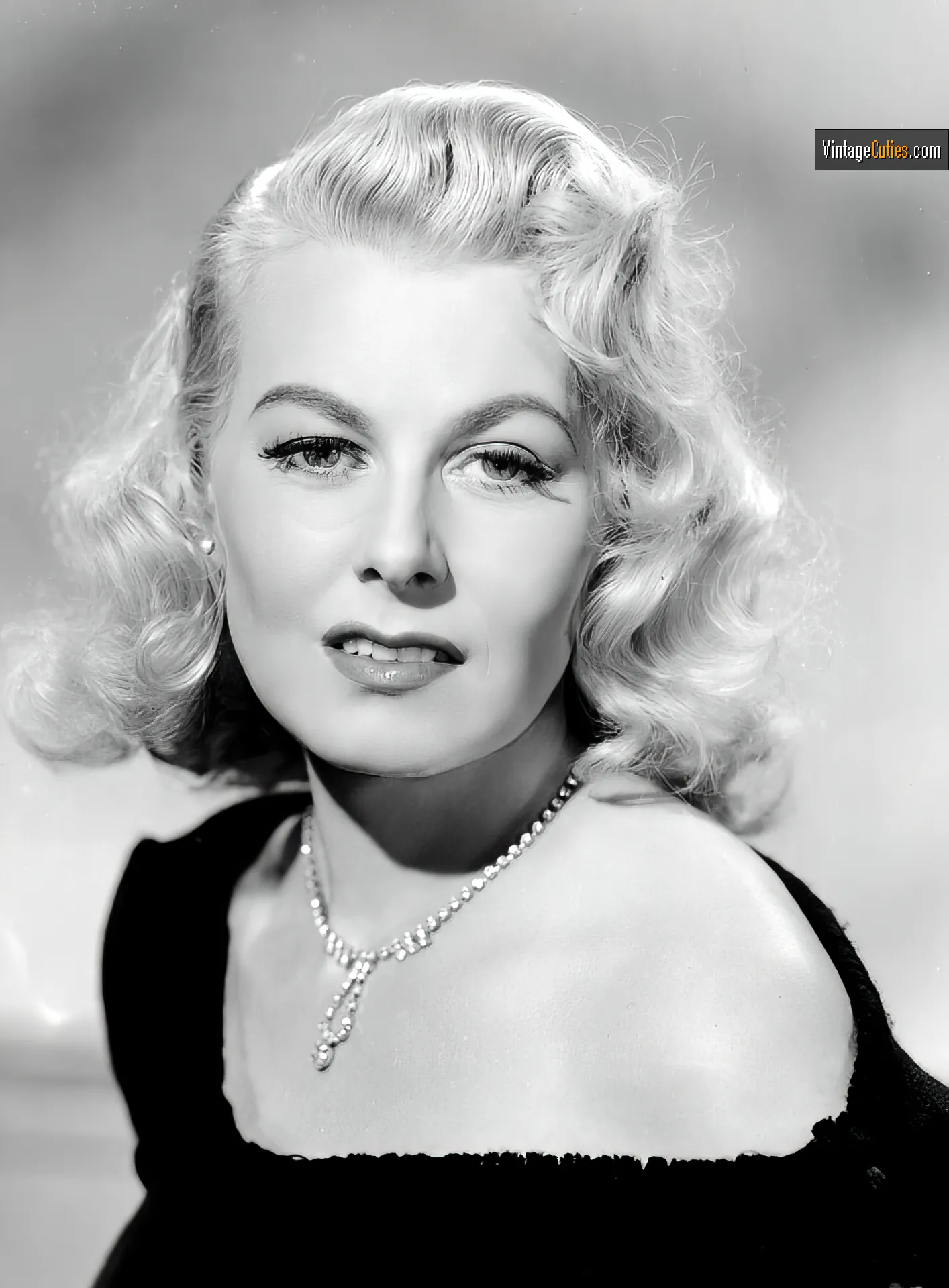 Beautiful vintage blonde actress poses for a photo portrait