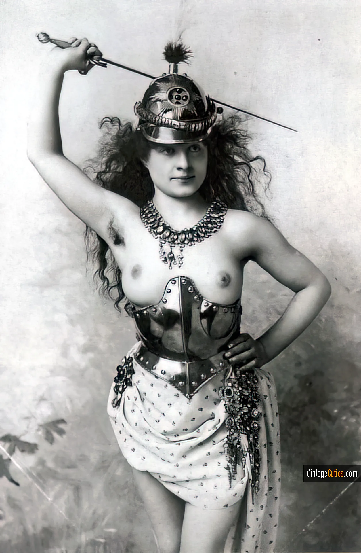 Brunette in extravagant antique costume with soft boobs