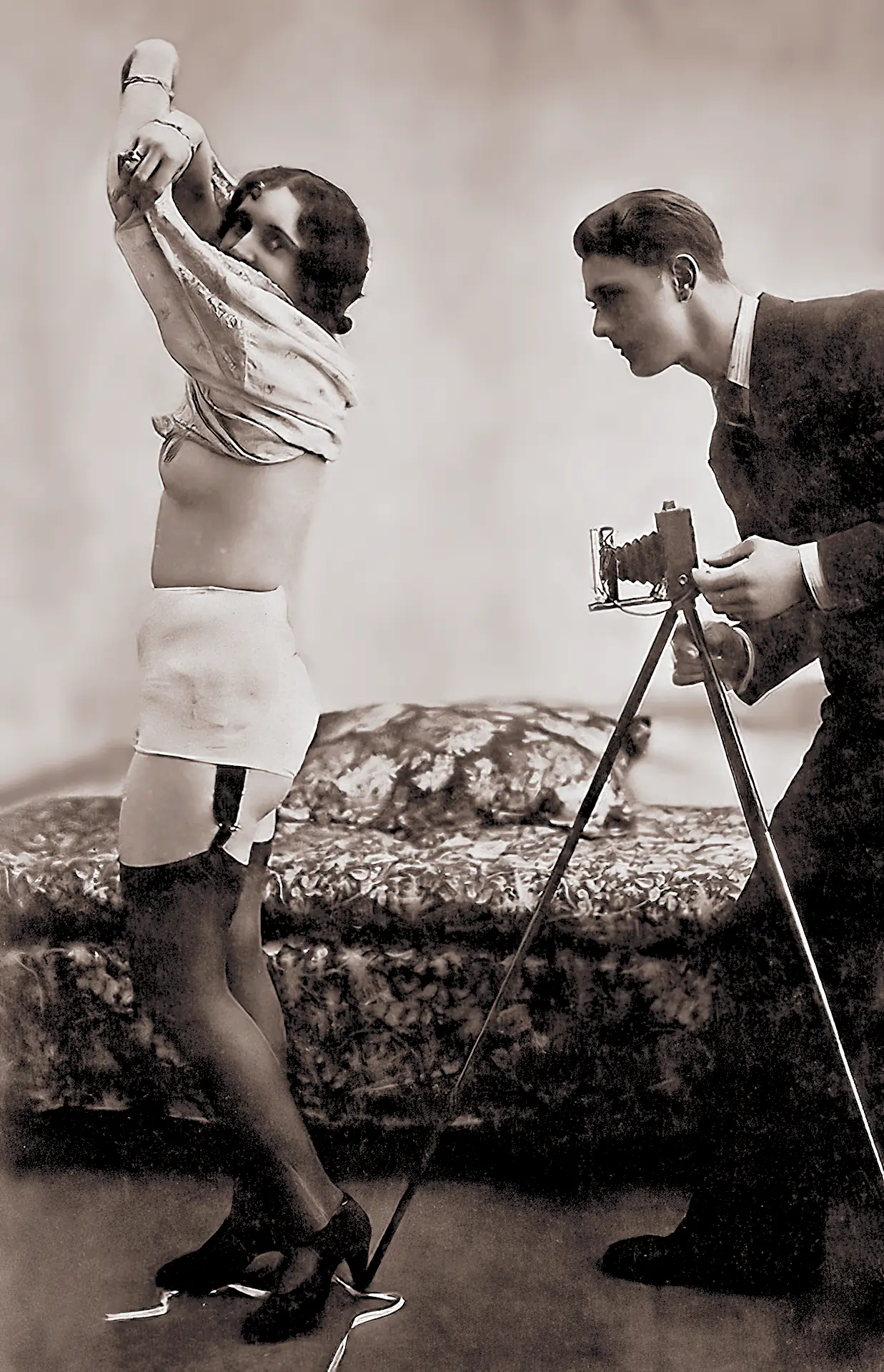 Vintage photoshoot porn photos with a photographer having a photo session where he's picturing an undressing braless woman