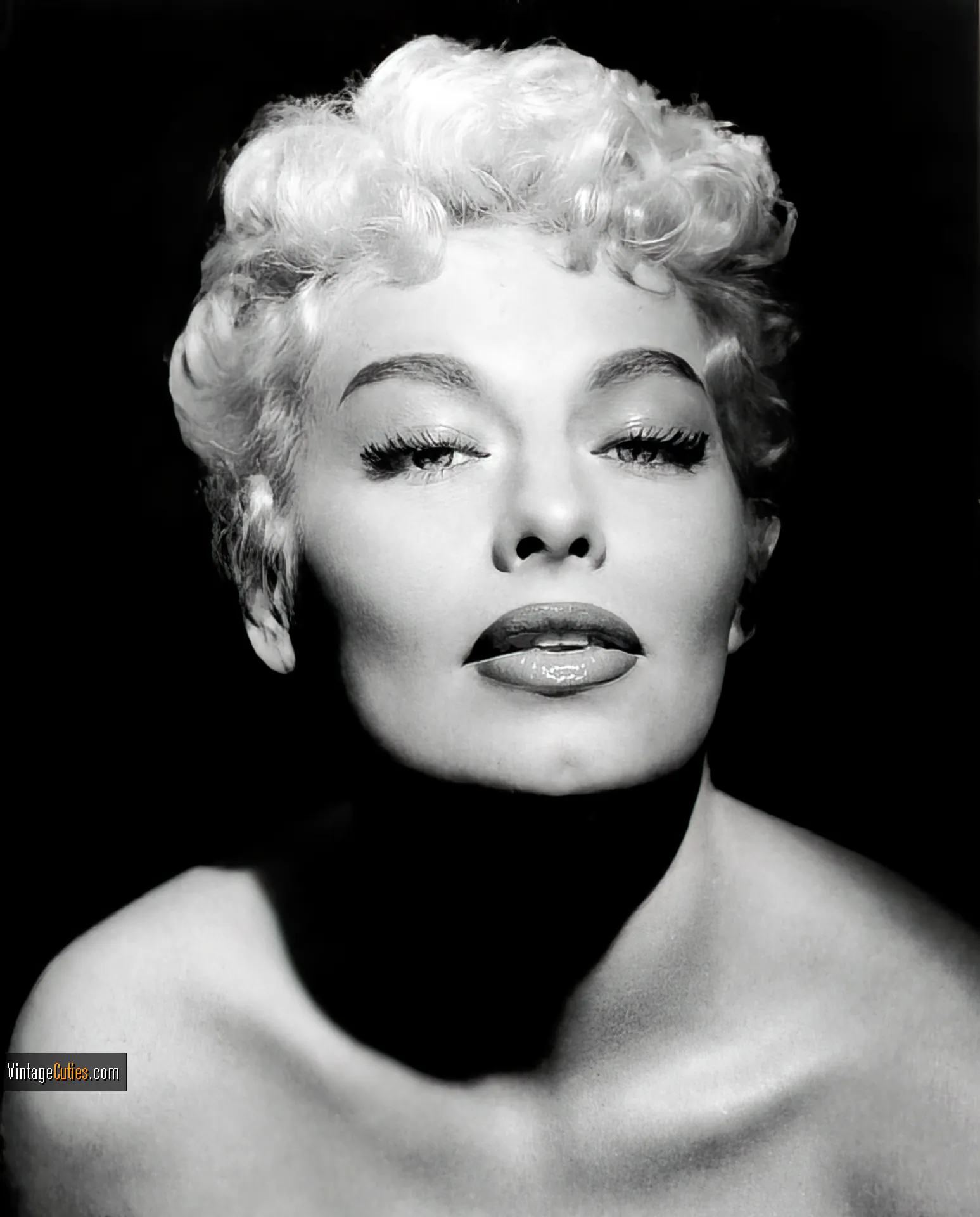 Beautiful Lili St. Cyr with plum lips and seductive eyes