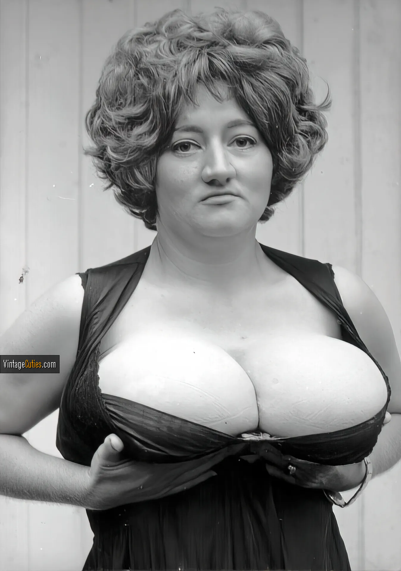Charming Busty Russell squeezes her soft cleavage