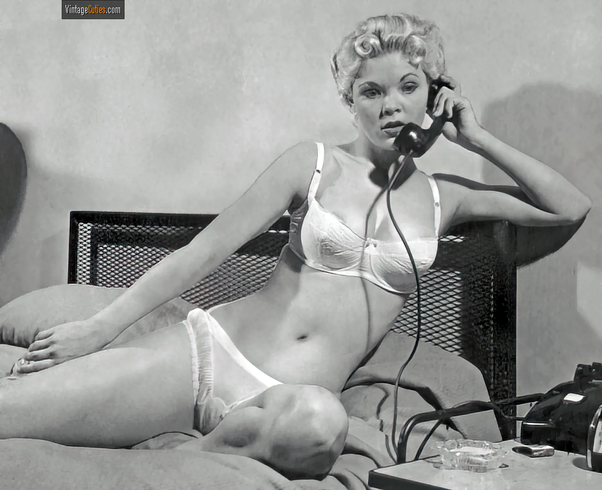 Dreamy Candy Barr talks on the phone in her white lingerie